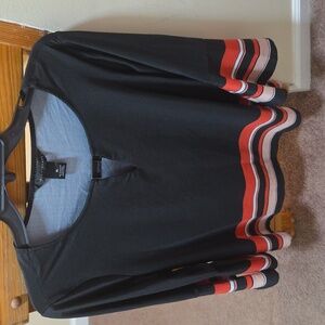 Shirt size XL and navy blue with red stripes. and white